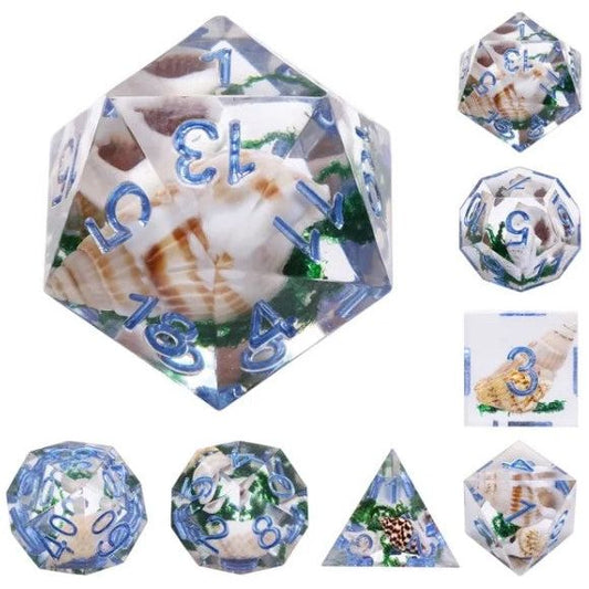A 7 pcs Polyhedral dice set used for Dungeons and Dragons, MTG , RPG Games etc. The dice included are 1- D4,1- D6,1- D8,1- D10,1- D00,1- D12, and 1- D20
Each die holds small seashells and greenery inside!