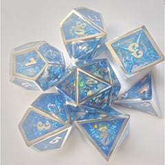 The perfect companion for your gaming needs! These premium dice are exactly what you've been searching for that upcoming game night with the group. Stored in a quality, brushed metal tin with foam insert. These dice are engraved with crisp, easy-to-read numerals. Many styles and colors are available.
This set includes on of each: d20, d12, d10, d10 (percentile), d8, d6, and a d4 (7 dice in total). All inside the Galactic Toys Dice Tin.