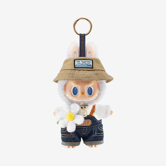 Introducing the limited-edition THE MONSTERS Fall in Wild Series – Vinyl Plush Doll Pendant, an irresistibly charming accessory inspired by the quirky universe of Labubu and The Monsters collection.
Key Features:
Charming Labubu Design – Miniature plush meets vinyl in one adorable character: Labubu wears denim overalls layered over a white T-shirt, accented by a brown bucket hat emblazoned with "The Monsters." Completing the look, a soft daisy peeks out playfully at his side. 
Expressive Vinyl Features –