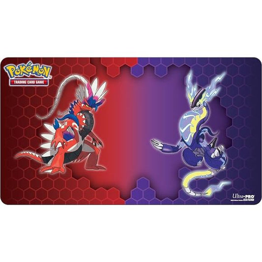 Officially licensed Pokémon Trading Card Game Playmat featuring Koraidon & Miraidon. Approximately 24 in. x 13.5 in. and lays flat. Soft fabric top helps protect cards during gameplay. Non-slip rubber backing keeps the playmat from shifting during use. Makes an excellent oversized mousepad for your home or office