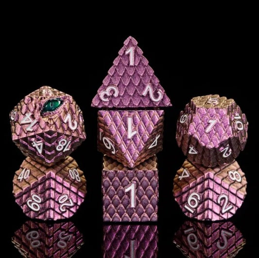 The perfect companion for your gaming needs! These premium die-cast polyhedral dice are exactly what you've been searching for that upcoming game night with the group. Each set weighs roughly 5 ounces and are stored in a quality, brushed metal tin with foam insert. These dice are engraved with crisp, easy-to-read numerals. Many styles and colors are available.

This set includes one of each: d20, d12, d10, d10 (percentile), d8, d6, and a d4 (7 dice in total). All inside a premium Dice Tin.