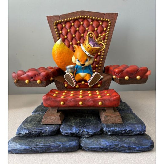 This statue has no edition number, and was a sample statue that has been displayed. As it has been displayed, it has a few dings & chips. The largest being the broken modern golden crown. This does not come with the display box.

The Sample Definitive Edition includes the following: Modern Golden Crown (damaged), Silver Goblet of Milk, Bejeweled Throne Footstool, a highly detailed Dias of which the throne is placed on, a glass of milk, a classic golden crown for Conker the King.

This does not come with the