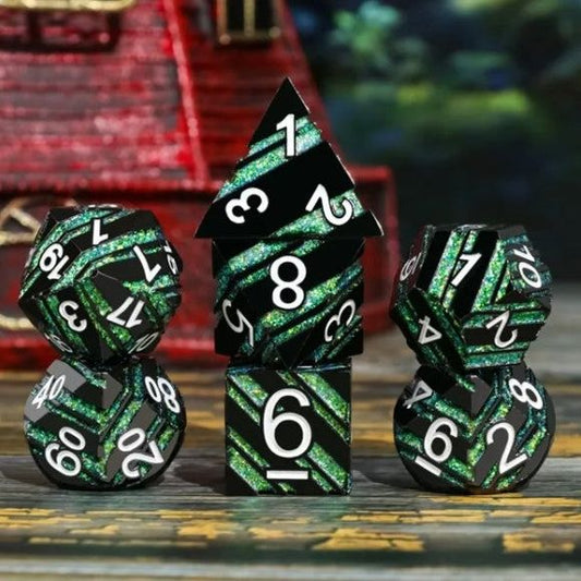 The perfect companion for your gaming needs! These premium die-cast polyhedral dice are exactly what you've been searching for that upcoming game night with the group. Each set weighs roughly 5 ounces and are stored in a quality, brushed metal tin with foam insert. These dice are engraved with crisp, easy-to-read numerals. Many styles and colors are available.

This set includes one of each: d20, d12, d10, d10 (percentile), d8, d6, and a d4 (7 dice in total). All inside a premium Dice Tin.