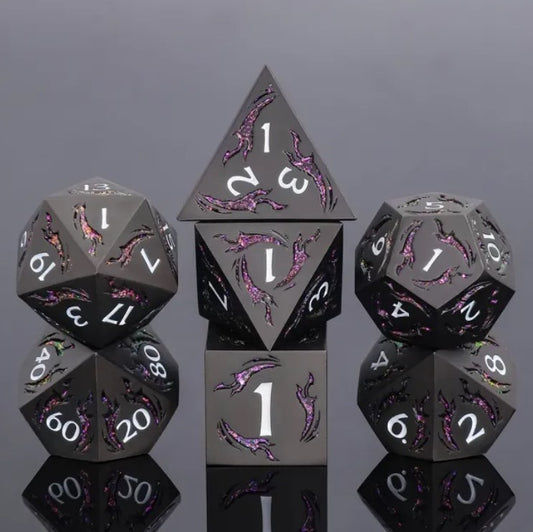 The perfect companion for your gaming needs! These premium die-cast polyhedral dice are exactly what you've been searching for that upcoming game night with the group. Each set weighs roughly 5 ounces and are stored in a quality, brushed metal tin with foam insert. These dice are engraved with crisp, easy-to-read numerals. Many styles and colors are available.

This set includes one of each: d20, d12, d10, d10 (percentile), d8, d6, and a d4 (7 dice in total). All inside a premium Dice Tin.