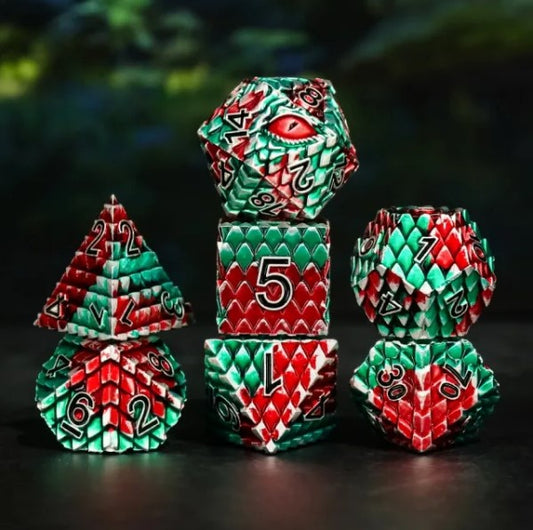 The perfect companion for your gaming needs! These premium die-cast polyhedral dice are exactly what you've been searching for that upcoming game night with the group. Each set weighs roughly 5 ounces and are stored in a quality, brushed metal tin with foam insert. These dice are engraved with crisp, easy-to-read numerals. Many styles and colors are available.

This set includes one of each: d20, d12, d10, d10 (percentile), d8, d6, and a d4 (7 dice in total). All inside a premium Dice Tin.